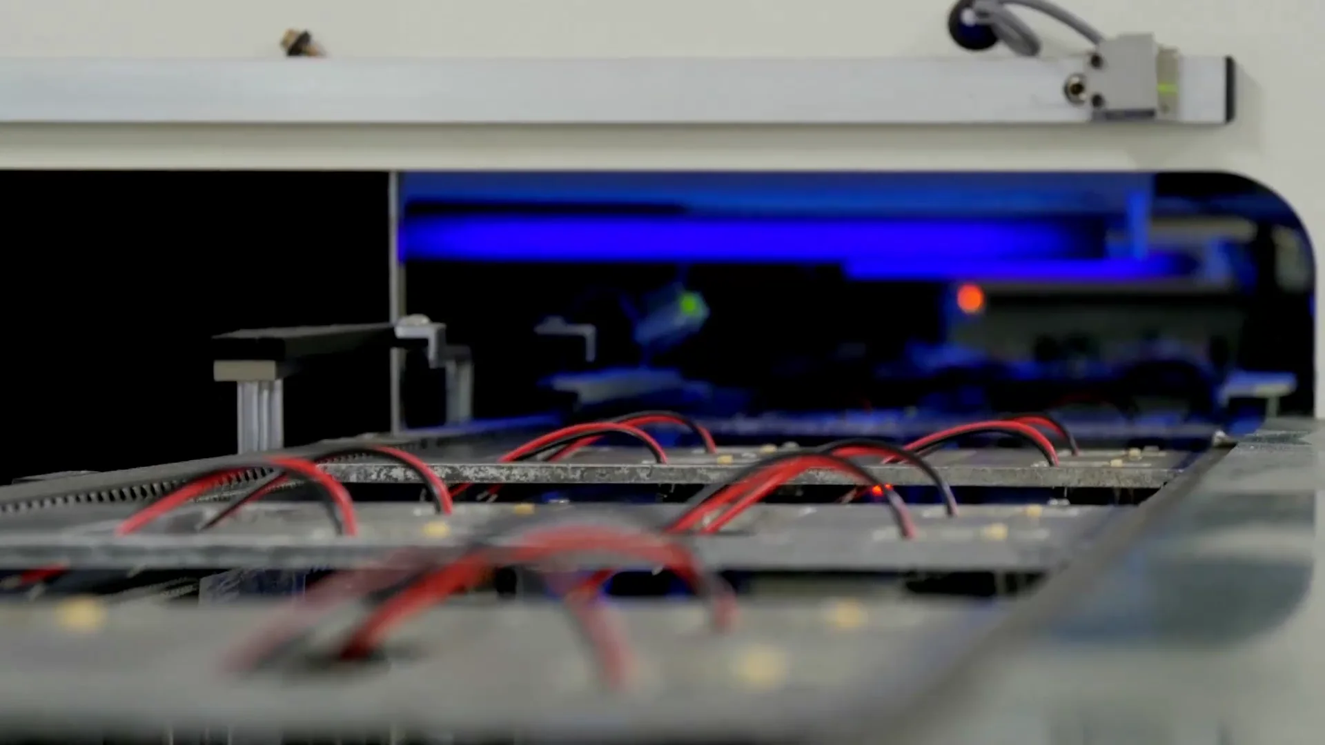 Automated electronics manufacturing equipment operating on a line